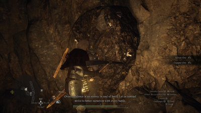 Der Spieler baut Steine in einer Höhle ab