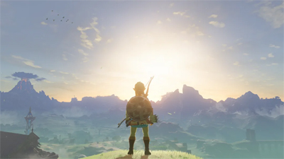 Links steht in Zelda Breath of the Wild auf einem Berg während dem Sonnenaufgang
