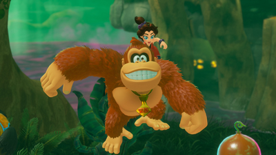 Donkey Kong grinst während einem Sprung in der Luft und sieht in die Kamera