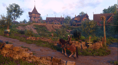 Geralt reitet einen Hügel hinauf mit Häusern im Hintergrund